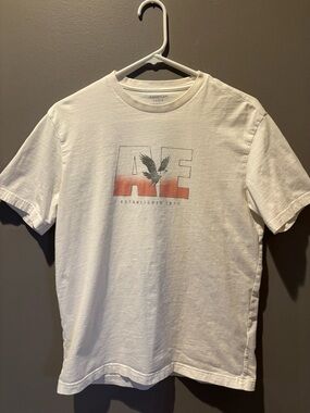 American Eagle Outfitters White Tee with Red/Orange Gradient AE Logo